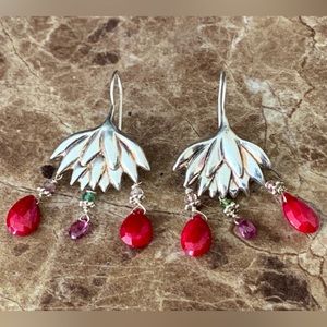 Sterling silver chandelier earrings with red and pink stones.